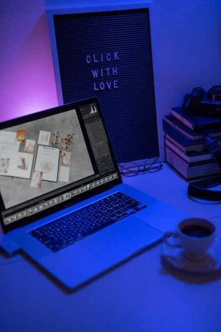 A minimalist desk setup featuring dual monitors, keyboard, mouse, and notebook for productivity.